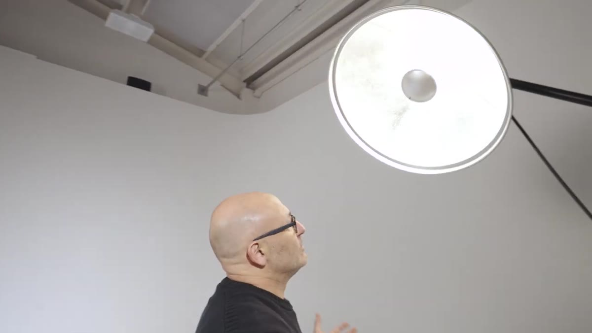Beauty dish positioned at 45-degree angle just above head height
