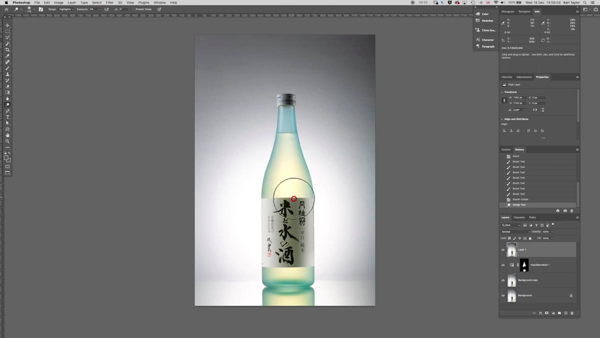 Dodge tool being brushed down the center highlight of the bottle