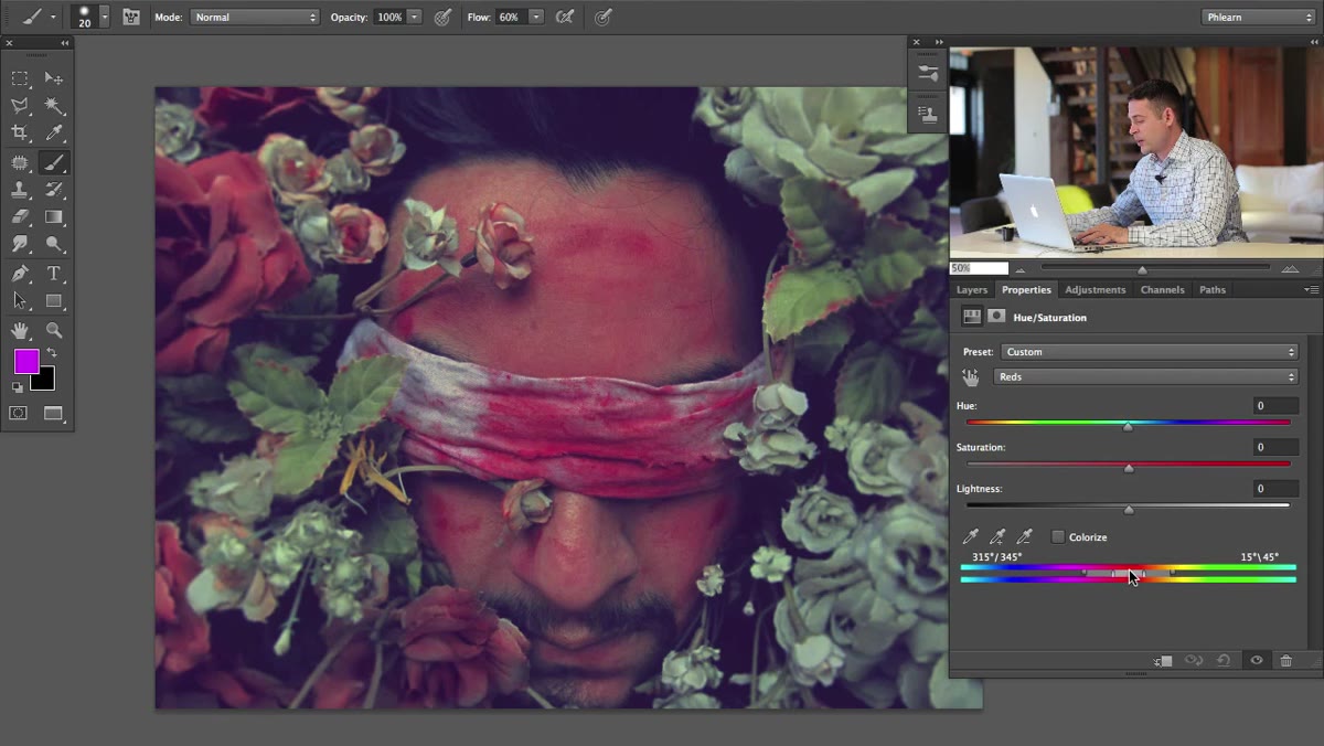 Color range gradient bar at bottom of Hue/Saturation panel with handles visible