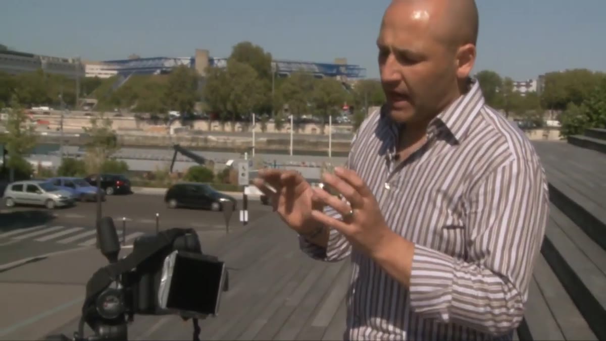 Neutral density filter attached to lens, sky visible in background