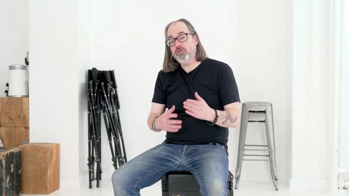 Daniel explaining the definition of retouching at his desk