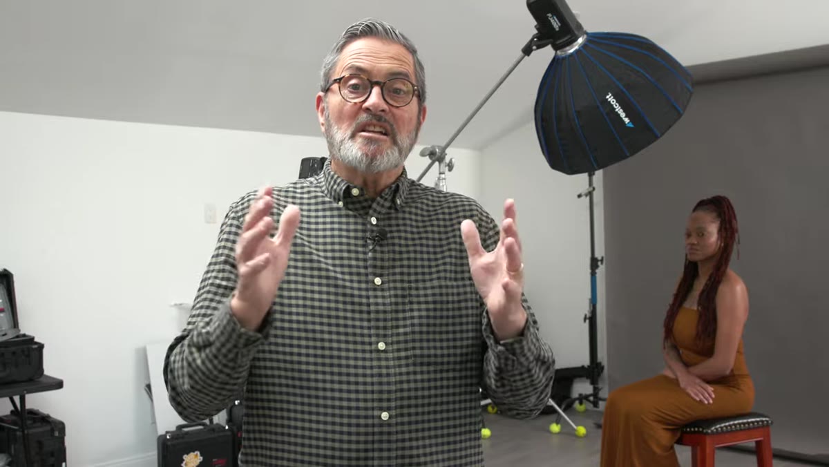 Jay P. Morgan standing beside 1x2 softbox and beauty dish